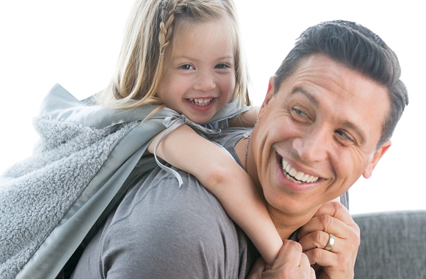 Father and daughter with blanket